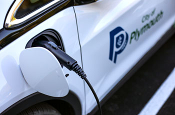 Electric vehicle utilizing a charging station