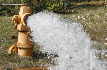 Photo of a water main being flushed