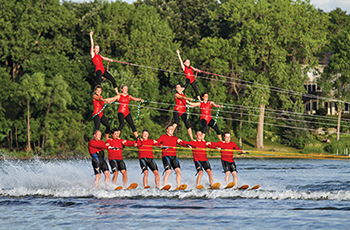 Photo of a water ski team in a pyramid formation