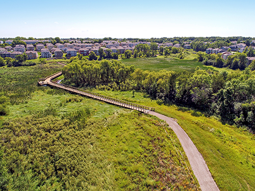 Aerial view of the Northwest Greenway, featuring a boardwalk and paved trail