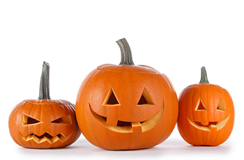 Image of three carved pumpkins