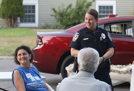 Photo of a Plymouth police officer interacting with residents