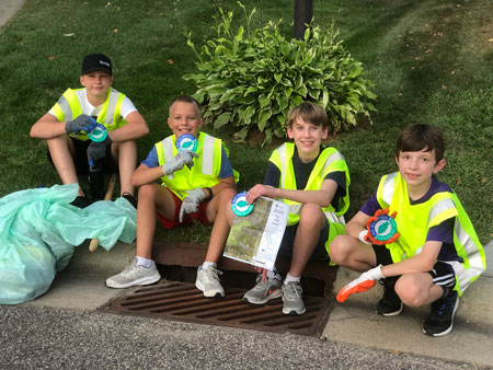 Participants from the Tweens Volunteer Group marking storm drains