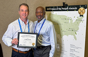 Plymouth City Manager Dave Callister (left) was presented the 2023 Voice of the People Award for Excellence in Education, Arts and Culture, awarded by Polco and the International City/County Management Association at the ICMA annual conference in October.