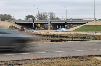 Photo of the newly opened County Road 9 bridge over Highway 169 with vehicles 