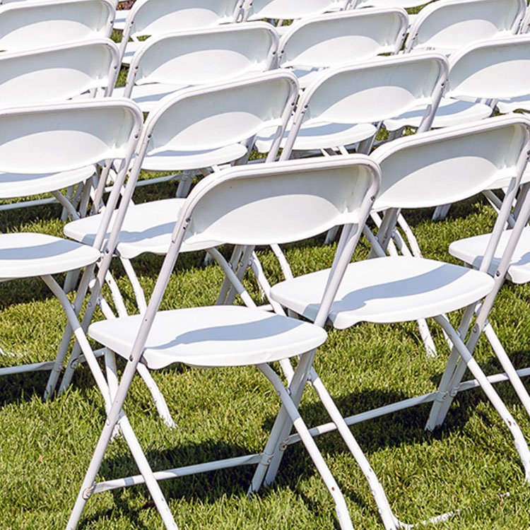 White folding chairs from Highway 55 Party Rental