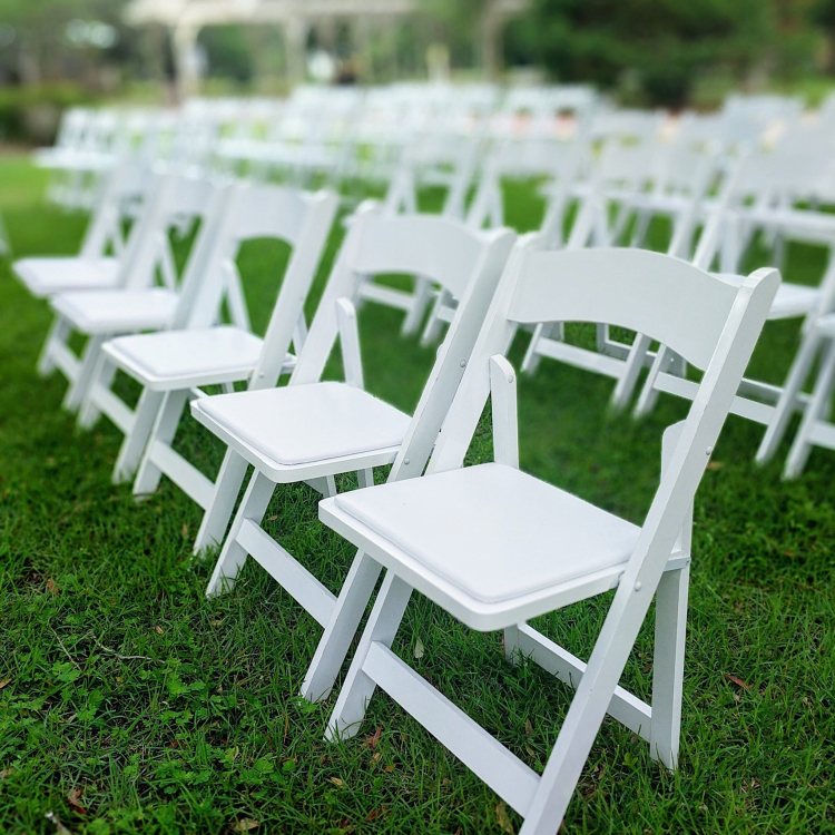 White resin chairs from Highway 55 Party Rental