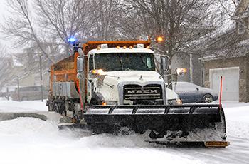 Photo of a plow truck clearing snow in Plymouth