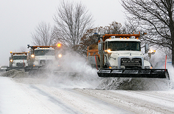 Photo of three plows clearing snow in Plymouth