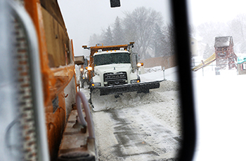 Image of a snowplow clearing roads in Plymouth