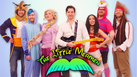 Image of 7 people dressed in bright costumes with the text "The Little Mermen" in front of them