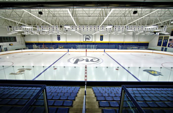 A photo showing an ice rink and seating at the Plymouth Ice Center