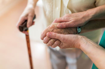 Two people holding hands