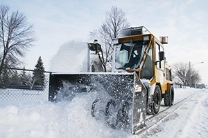 City of Plymouth plowing trails and sidewalks