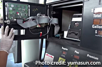 Skimming device at a gas station pump. Photo credit: yumasun.com