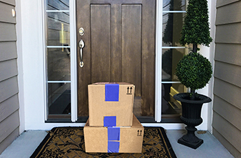 Packages sitting on front doorstep outside