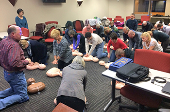 Plymouth residents learning CPR at a Heart Safe Plymouth training