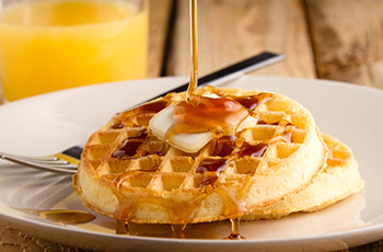 Belgian waffles with fruit and whipped cream