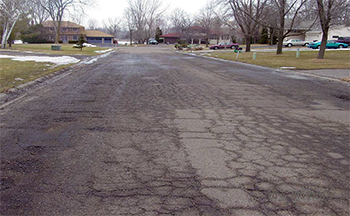 A street in poor condition before the reconstruction project