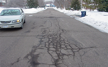 A street in poor condition before the reconstruction project