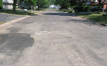 A street in poor condition before the project