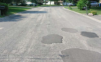 A street in poor condition before the project