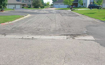 A street in poor condition before the project