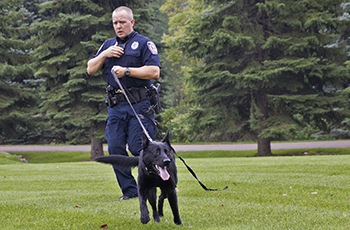 Plymouty Police Officer Steve Larson with K9 Knight