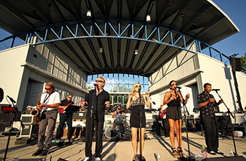 Entertainers performing outside at Music in Plymouth