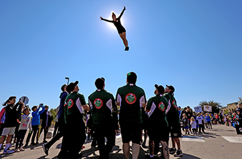 Gymnastics team doing tricks during Plymouth on Parade