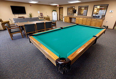 Pool table and TV in a recreation room