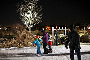 Families skating in the Millennium Garden