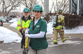 CERT Volunteers carrying rescue equipment