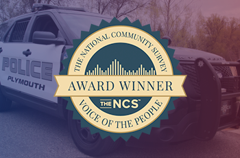 Image of Plymouth Police car and Voice of the People Award badge