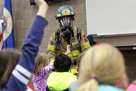 Plymouth firefighter teaching school children 