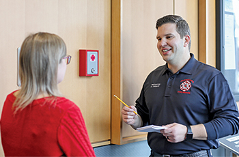 Plymouth firefighter checking a key box