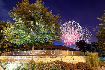 Music in Plymouth fireworks visible behind City of Plymouth sign